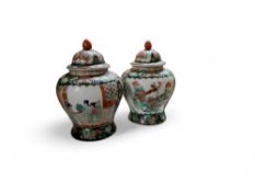 A pair of Chinese famille noire baluster vases and covers, 30cm high, 20th century