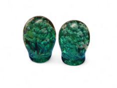 A Victorian green glass dump, bubble inclusions, 12.5cm high, c.1860;  another, 11cm high (2)
