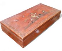 A large Chinese scholar's work box, red lacquer with raised traditional pseudo-Oriental temple scene