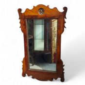 A George II Revival walnut Vauxhall mirror, parcel gilt Tudor rose motif, planked back, 75cm high
