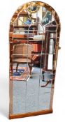 A large Art Deco mirror, shaped peach glass border, 141cm high