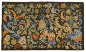 An 18th century style tapestry, central pineapple flanked by mythical beasts and geometrical