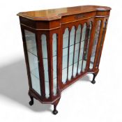 A late Victorian walnut and mahogany Gothic Revival display cabinet, raised on cabriole legs