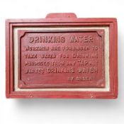 An early 20th century mounted cast iron 'Drinking Water' sign, possibly of railway interest; stating