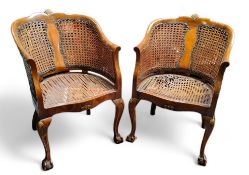 A pair of 1920's walnut French Bergere tub chair, gilded scallop carved bowed back back rest,