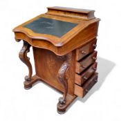 A Victorian satinwood inlaid walnut Davenport, the hinged pen holder above serpentine black