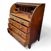 A George III mahogany roll top bureau, tambour front revealing pigeon holes and drawer lined