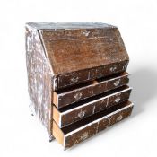 A George III oak bureau, partially stripped with distressed paint c.1800
