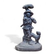 A Victorian cast iron door stop in the form of a huntsman with his rifle and gun dog, 38cm high