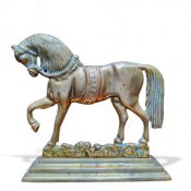 An early 20th century brass library desk weight in the form of a stallion conformation, 26cm wide