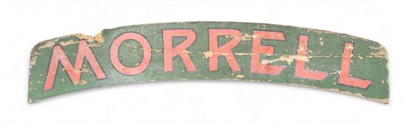 Advertising - an early 20th century sign written arched wooden sign,  'Morrell',  painted in red and