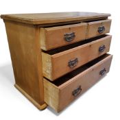 An Arts & Crafts farmhouse pine chest of drawers, two short above two long, bold pressed metal