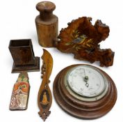 An early 20th century oak circular barometer, 18cm diam, c.1930;   a late 19th century treen match