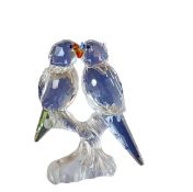 A Swarovski Crystal model, of two budgies, perched on a branch, 8cm high, boxed
