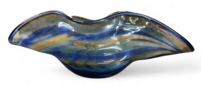 A large Murano glass wavy bowl, combed in tones of blue and yellow, 42cm wide, signed