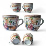 An 18th century Chinese teacup, painted in the famille rose palette with two Chinese figures being