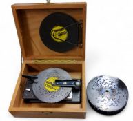 A Thorens music disc player, twenty 4.5in cut steel discs with playing airs