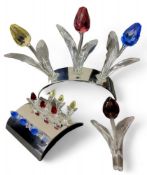 Three Swarovski Crystal tulips, in yellow, red and blue, on a chrome stand;  another, red;   nine