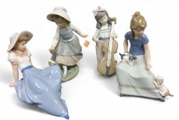 A Nao figure, of a girl with a cello, 19cm high, printed mark;  others, girl with puppies, girl