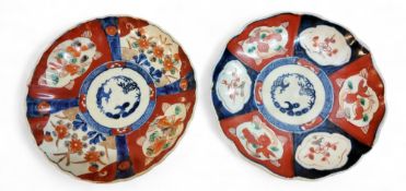 A pair of Japanese Imari shaped circular plates, decorated in the typical palette, 21.5cm diam,