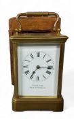A French brass cased carriage clock, beveled glass panels,  retailer  P. Orr & Sons, Madras &