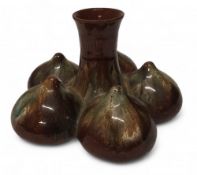 A Linthorpe pottery onion vase,  central stem with five onions, dripped glaze in green and brown,