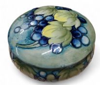 A Moorcroft Leaf and Berries pattern powder pot and cover, tube lined with autumn leaves and berries