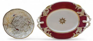 A Rockingham shaped circular saucers, pattern 1104,  decorated with fanciful birds and gilt