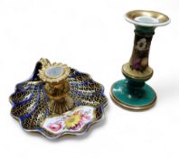 An 18th century  English porcelain chamberstick, flying scroll handle, the sconce in relief with