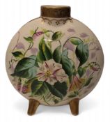 A 19th century English pottery moon flask, painted with flowers, on four gilt feet, 15.5cm high,