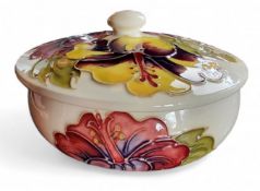 A contemporary Moorcroft Hibiscus pattern powder bowl and cover cover, tube lined with large
