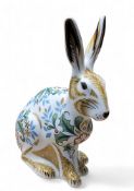 A Royal Crown Derby paperweight, Winter Hare, 13cm high, gold stopper, printed mark in grey
