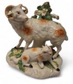 A Derby Patch Mark model, a ram and ewe, before bocage,  shaped base encrusted with foliage, 13.