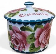 An early 20th century Wemyss cylindrical biscuit box and cover, painted cabbage roses and foliage,