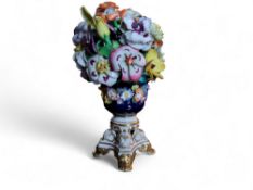 A Bloor Derby floral vase, encrusted with colourful summer flowers, campana shaped base, applied