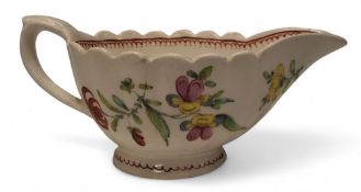 A Bow fluted sauceboat,  painted with a colourful  bouquet and trailing flowers, the foot and