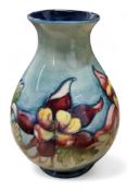 A Moorcroft Columbine pattern ovoid vase, tube lined with large flowerheads in tones of puce, yellow