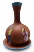 A Torquay terracotta bottle vase and stand, enamelled with classical figures, 25cm high, c.1880