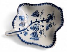 A Lowestoft leaf shaped pickle dish,  painted in underglaze blue with grape vine, pineapple