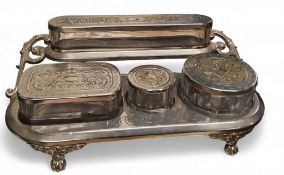 A W.M.F. plated waterfall standish, with clear facetted glass boxes, the covers embossed with