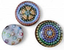 A later 20th century Baccarat style glass paperweight, of domed form, internally decorated with