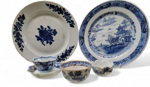 An 18th century Chinese plate, decorated in underglaze blue with pagoda and pine trees, diaper