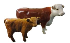A Beswick Hereford cow, Ch. Of Champions, printed mark;  a similar Highand calf (2)