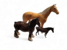 A Beswick palomino horse, large hunter, model 1734;  another, bay shire, model 818;  another (3)