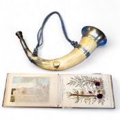 A late 19th century silverplated cow horn bugel; an early 20th century olive wood botany book with