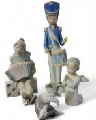 A Lladro figure, Boy with Accordion on Domino, No. 1179; others, Child Drummer, 1167;  Angel