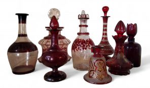 A 19th century Bohemian ruby glass scent bottle and stopper, etched with fruiting vine, 15cm high,