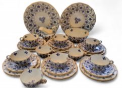 A Coalport tea service, comprising two bread and butter plates, sugar bowl, milk jug, twelve side