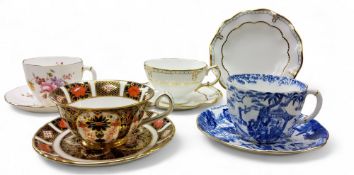 A Royal Crown Derby 1128 pattern teacup and saucer, printed mark, second;  others, Posies,