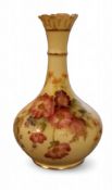 A Royal Worcester bottle vase, printed and painted with summer flowers, on a blush ivory ground,